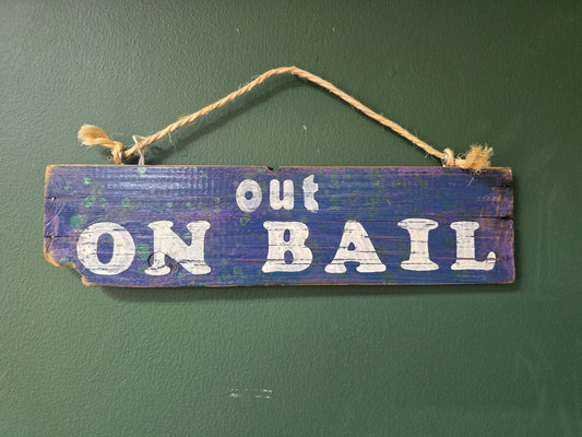 Blue Out on bail sign by Bongo Jesus