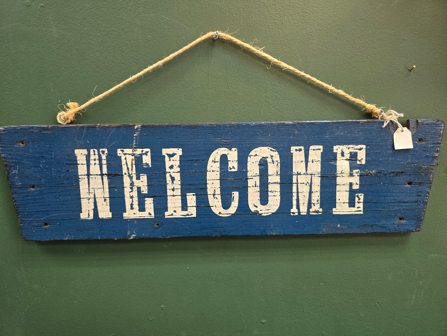 Blue Welcome Sign by Bongo Jesus